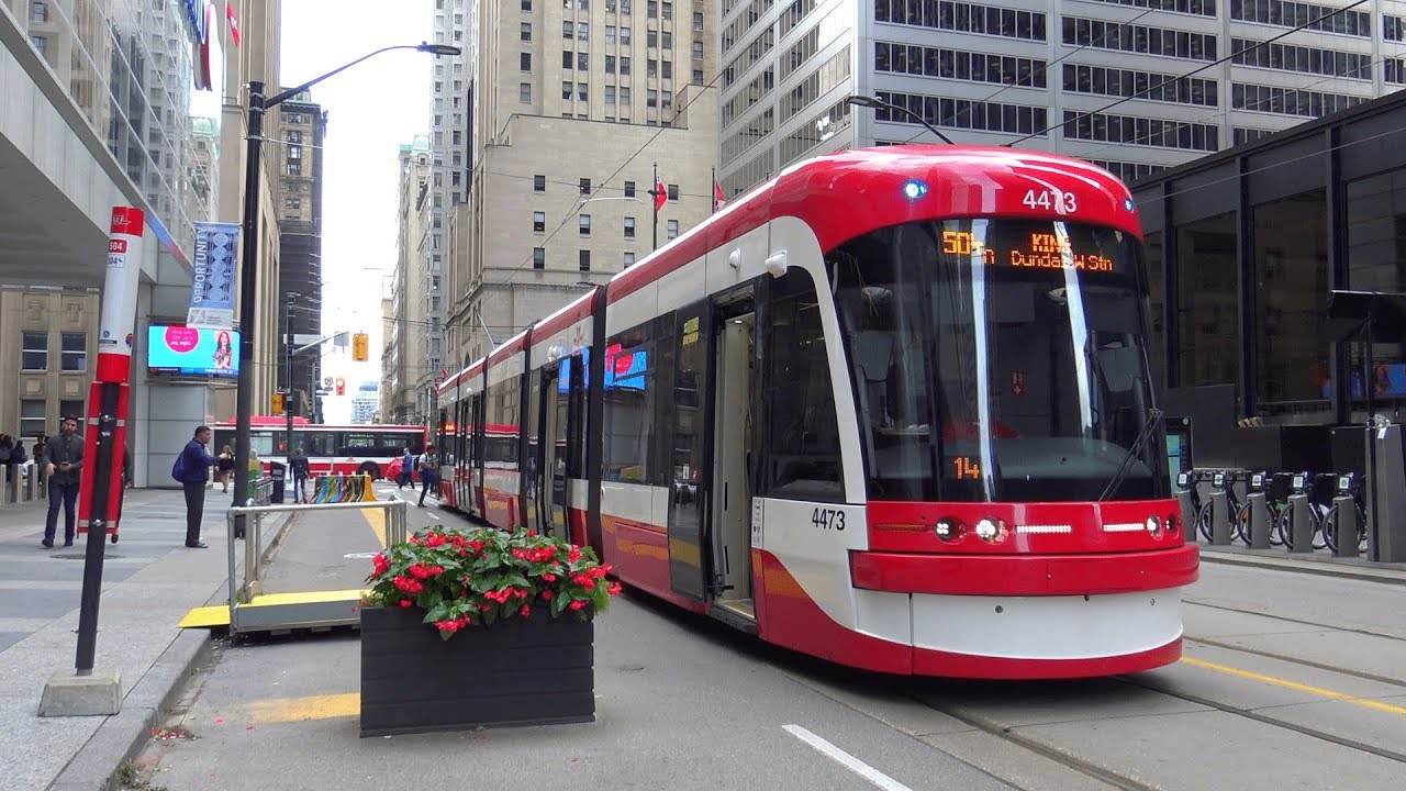 toronto street car white and red street car in downtown toronto