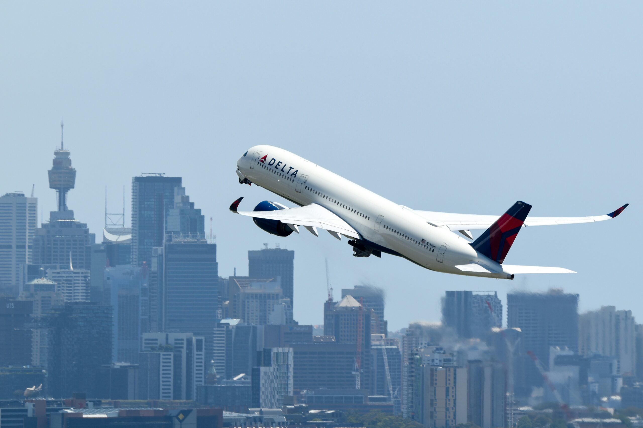 david-syphers-yqBlPMD9UE8-unsplash Worker Walking With Luggage To Airplane